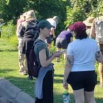 People chatting on the shore of Grass Lake for a Bio Blitz